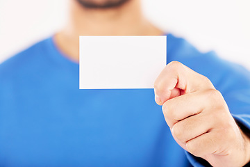 Image showing Mockup, business card and hands in studio for advertising, branding about us or information sign. Closeup of person show space on paper for promotion, contact note or announcement on white background