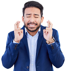 Image showing Hope, business man and fingers crossed while waiting for announcement, bonus feedback or sign on white background. Face of nervous asian worker wish of belief, emoji or anxiety of promotion in studio