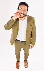 Image showing Smile, excited and businessman pointing up at promotion deal isolated in a white studio background for a sale. Promo, branding and happy employee or worker showing advertising product placement