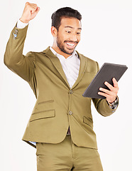 Image showing Happy asian man, tablet and fist pump in celebration for winning, discount or sale against a white studio background. Excited businessman with technology in success for good news, bonus or promotion