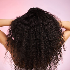 Image showing Hair, beauty and back of person with hairstyle transformation and curly texture. Model, salon treatment and haircut shine in a studio with pink background and cosmetics with keratin and growth care