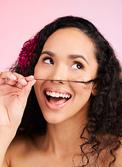 Image showing Hair care, wellness and young woman in a studio with natural, beautiful and long curls. Happy, smile and female model from Mexico with a shiny salon treatment hairstyle isolated by a pink background.