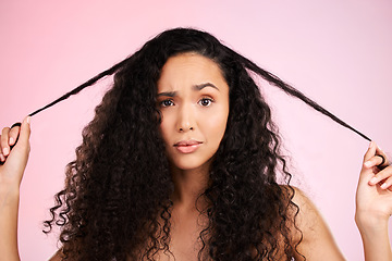 Image showing Hair damage, portrait and confused woman with beauty treatment and hairstyle and problem. Cosmetics, face and female person in studio worried from shampoo care and split ends with pink background