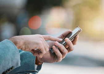 Image showing Hands, typing or person with a phone in city for social media data, location or notification. Closeup, website or entrepreneur with a mobile app for online direction, news or email in morning travel