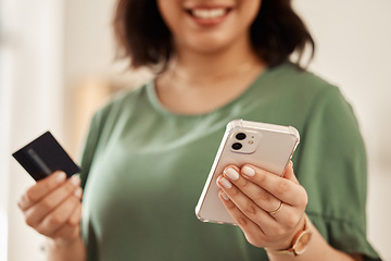 Image showing Phone, credit card and hands of happy woman with online shopping and banking at home. Ecommerce, mobile and sale with digital payment on web cashback with discount and smile from website checkout