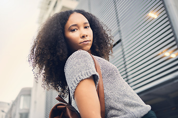 Image showing .Fashion, city and portrait of woman on vacation or holiday in a travel location or urban town with a trendy backpack. Outdoor, serious and young person with cool, style and funky hair in summer.