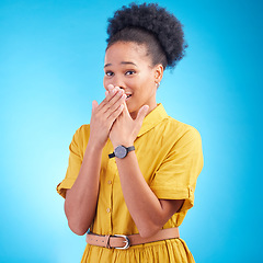 Image showing Surprise, omg and hand on face of black woman in studio embarrassed by gossip, rumor or fake news on blue background. Wtf, shock and African lady with emoji reaction to secret, drama or announcement