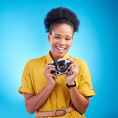 Image showing Photography, portrait and black woman with camera, smile and isolated on blue background, creative artist job and talent. Art, face of happy photographer with hobby or career in studio for photoshoot