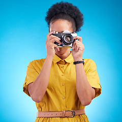 Image showing Photography, travel and black woman with camera isolated on blue background, creative artist job and talent. Art, face of photographer with hobby or career in studio taking picture for photoshoot.