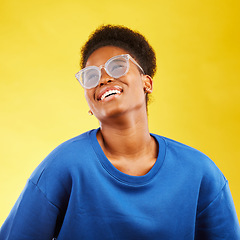 Image showing Happy, fashion and glasses with face of black woman in studio for vision, eye care and trendy style. Gen z, smile and happiness with female person on yellow background for expert, health and idea