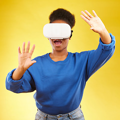 Image showing Gaming, metaverse and wow with black woman and vr headset in studio for digital, 3d and augmented reality. Technology, future and gamer with female person on yellow background for scifi and gen z