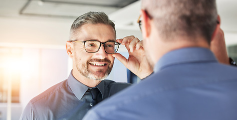 Image showing Glasses, choice and senior man, mirror and vision with eyewear in clinic, prescription lens with designer frame. Eyesight, eye care and optometry, healthcare and male person with spectacles decision