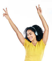 Image showing Music, dancing and a woman with headphones and peace sign in studio streaming audio, sound or radio. Energy, happy and a young person isolated on a white background listening to fun song to relax