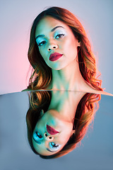 Image showing Art, mirror and beauty, portrait of woman on studio background with neon light and makeup. Fashion, skin and future aesthetic, face of girl or model in creative reflection with cosmetics and color.