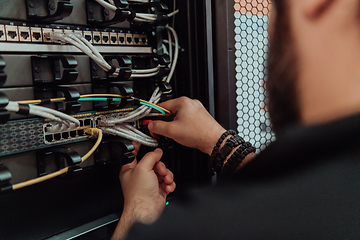 Image showing Close up of technician setting up network in server room