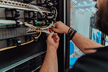 Image showing Close up of technician setting up network in server room