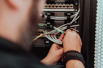 Image showing Close up of technician setting up network in server room
