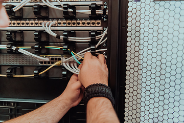 Image showing Close up of technician setting up network in server room