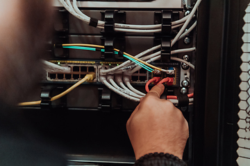 Image showing Close up of technician setting up network in server room