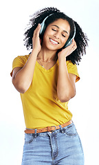 Image showing Music, happy and a woman with headphones in studio streaming audio, sound or radio. Peace, smile and a young African person isolated on a white background listening to fun song to relax or meditate