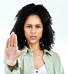 Image showing Stop, hand and portrait of woman in studio with warning, sign and threat, limits or no on white background. Protest, palm and face of lady with emoji for forbidden, rejection or defense control vote