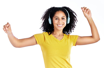 Image showing Dance, music and portrait of a woman with headphones in studio streaming audio, sound or radio. Energy, happy and African person isolated on a white background listening and moving to fun song