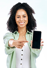 Image showing Screen, mockup or portrait of happy woman with phone on white background on social media or product placement. Pointing, smile or person showing mobile app website or tech mock up space in studio