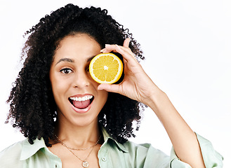 Image showing Vitamin c, lemon and eye or portrait of woman with fashion for organic wellness isolated in a studio white background. Diet, fruit and happy or excited young person with crazy citrus energy and detox