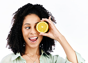 Image showing Citrus, lemon and eye of woman with fashion for organic wellness isolated in a studio white background. Diet, fruit and happy or excited young person with crazy vitamin c energy, health and detox