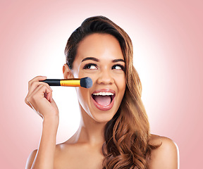 Image showing Beauty, eyeshadow and face of happy woman with makeup brush for salon, wellness or luxury. Cosmetology, aesthetic and female person with tools for foundation, cosmetics and glamour on pink background