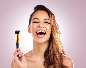 Image showing Beauty, laugh and portrait of woman with makeup brush on pink background for salon, wellness and luxury. Cosmetology, aesthetic and female person with tools for foundation, face cosmetics and glamour