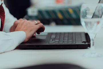 Image showing Close up of business hands are typing on laptop.