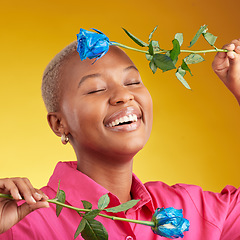 Image showing Happy, smile and spring with black woman and rose in studio for blossom, plant and environment. Gift, love and blue flower with face of person on yellow background for floral, scent and mockup