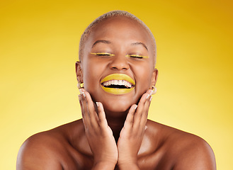 Image showing Happy, gold makeup and a black woman on a studio background for creativity, skincare and beauty. Laughing, wellness and an African model or girl with lipstick isolated on a backdrop for an aesthetic