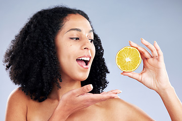 Image showing Skincare, excited and woman with lemon in studio isolated on a white background. African model, natural food and fruit for nutrition, vitamin c and healthy diet for beauty benefits, wellness or vegan