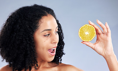 Image showing Woman, lemon and thinking for skincare, studio and wow for natural results for health by background. Girl, African model and fruit for cosmetics, self care and surprise with idea, aesthetic and glow