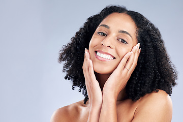 Image showing Beauty, skin and a woman with hands on face for dermatology, cosmetics and natural makeup. Portrait of a happy african female model on a studio background for facial self care, glow and soft touch