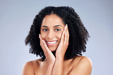 Image showing Skin, beauty and a woman with hands on face for dermatology, cosmetics and natural makeup. Portrait of a happy african female model on a studio background for facial self care, glow and soft touch