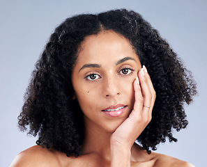 Image showing Portrait, hair and beauty with a model woman in studio on a gray background for skincare. Face, aesthetic and shampoo with a young female person at the salon for natural wellness or treatment