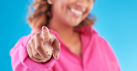 Image showing Pointing, finger choice and a woman on a blue background for recruitment, hiring and motivation. Smile, offer and hand of a person or girl with a decision isolated on a studio backdrop for promo