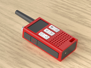 Image showing Walkie talkie on wooden desk
