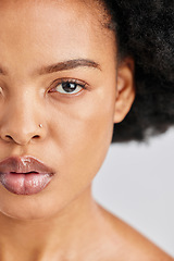 Image showing Beauty, studio portrait and African woman with skincare shine, foundation makeup and natural cosmetics for skin glow. Closeup half face, eye and person with self care wellness on white background