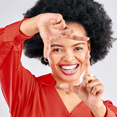 Image showing Portrait, finger frame or face of black woman in studio to review profile picture on white background. Happy female model, hands or planning perspective of photography, selfie or creative inspiration