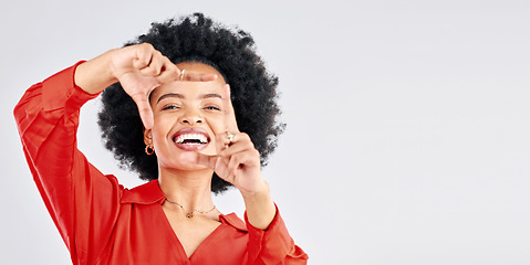 Image showing Happy, portrait and black woman with hand frame for a selfie, picture or capture on a studio background. Smile, mockup and an African girl with a gesture for a photo isolated on a backdrop with space