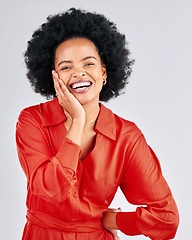 Image showing Portrait, happy and fashion with an afro black woman in studio on a white background for trendy style. Aesthetic, smile and red clothes with a confident young female model posing in a clothing outfit