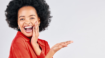 Image showing Happy black woman, portrait and afro with palm for advertising against a white studio background. Excited African female person in wow for showing advertisement, branding or marketing on mockup space