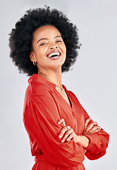 Image showing Portrait, fashion and arms crossed with an afro black woman in studio on a white background for trendy style. Smile, confident and red with a happy young female model posing in a clothes outfit