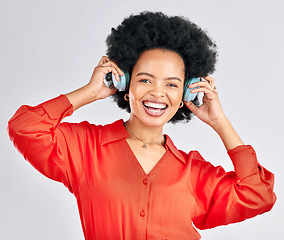 Image showing Portrait, black woman and music headphones in studio for podcast, audio and subscription on white background. Face of happy female model listening to album, streaming sound and hearing song on radio