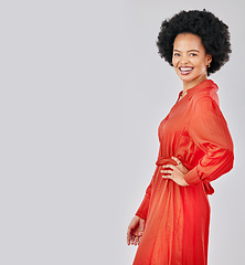 Image showing Portrait, fashion and space with an afro black woman in studio on a white background for trendy style. Mockup, smile and red clothes with a happy young female model posing in a clothing outfit