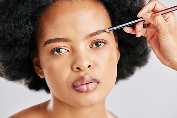 Image showing Portrait, african woman and beauty with eyebrows in grey studio background for facial. Portrait, beauty and face with girl drawing brow with makeup for transformation for cosmetology or self care.